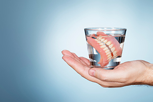 Dentures in a glass of water.
